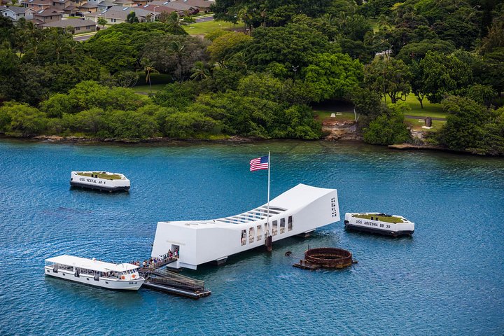 Floating memorial in harbor with boats